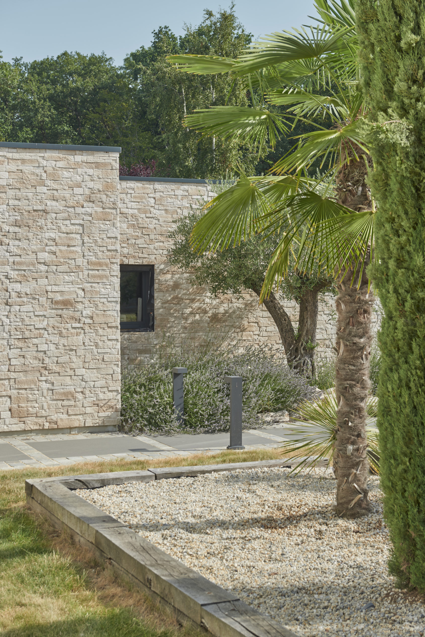 Modern house clad in natural-tone Cubik siding from ORSOL